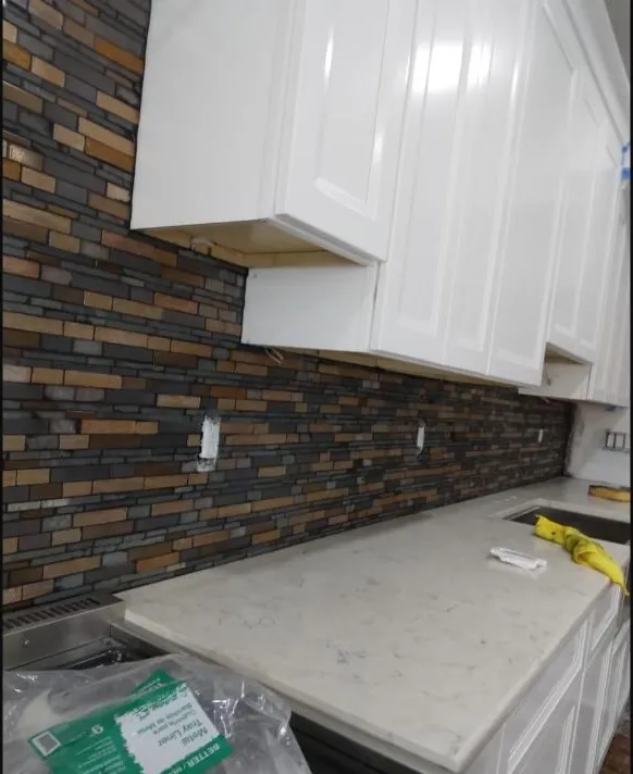 Stone backsplash, white cabinets & quartz
