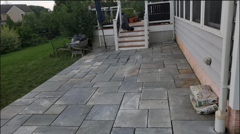 Flagstone patio by covered porch