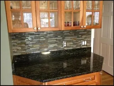 Granite countertop with mosaic backsplash
